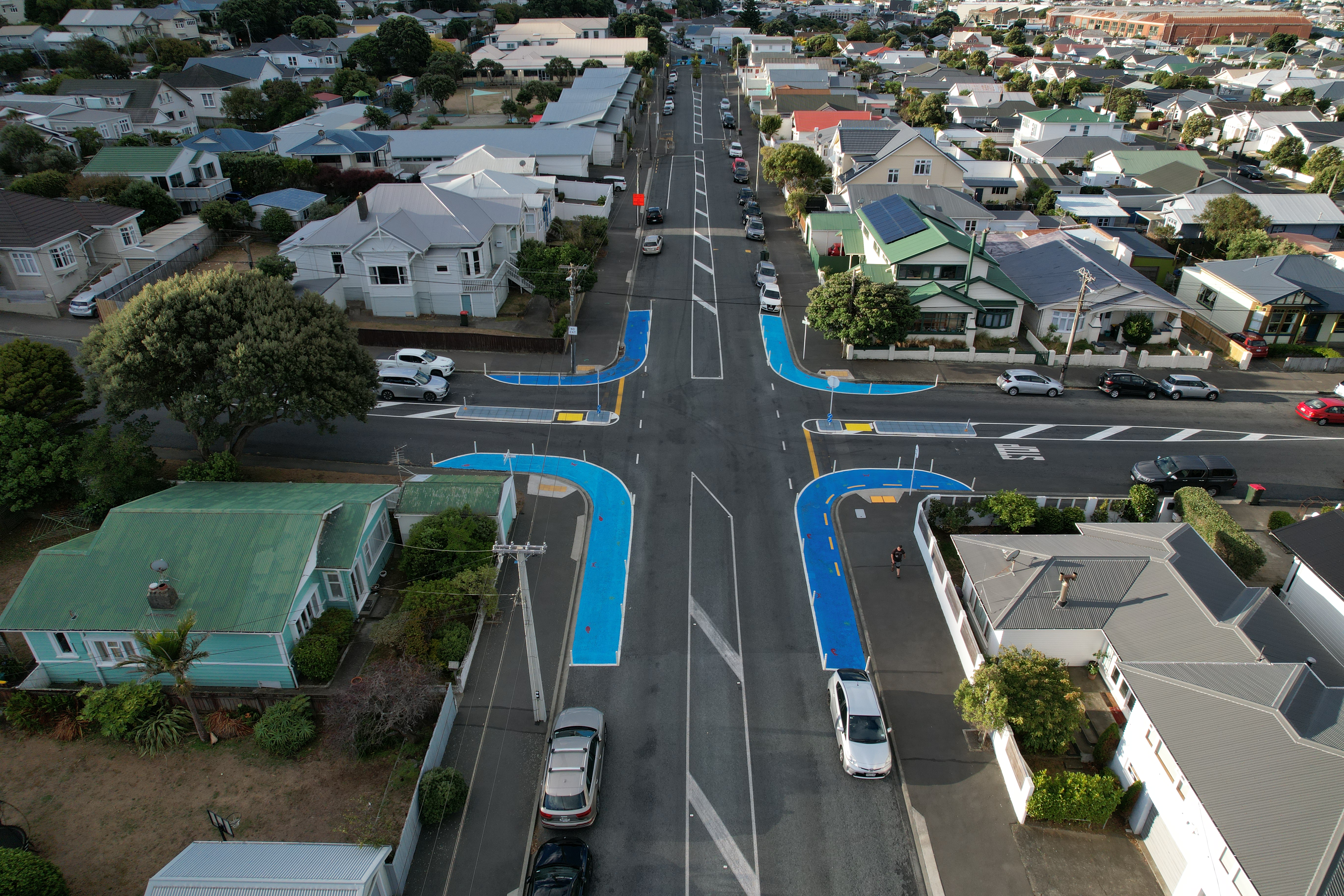 Photo shows birds eye view of new street layout with blue paint on corners.